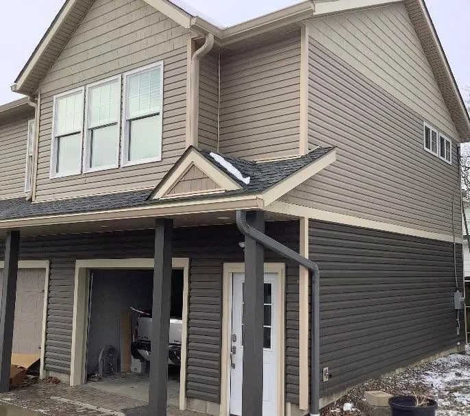 Seamless gutters on a dark exterior — Rainman Gutters, Wadsworth OH